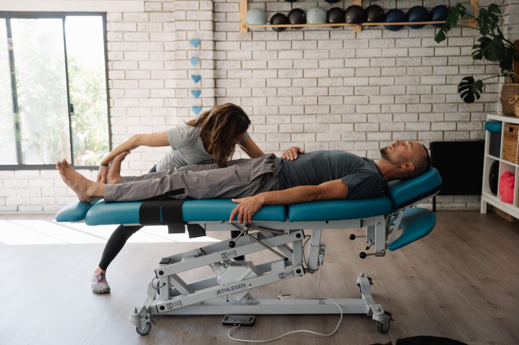 Stretch Therapist performing a full body stretch on a client