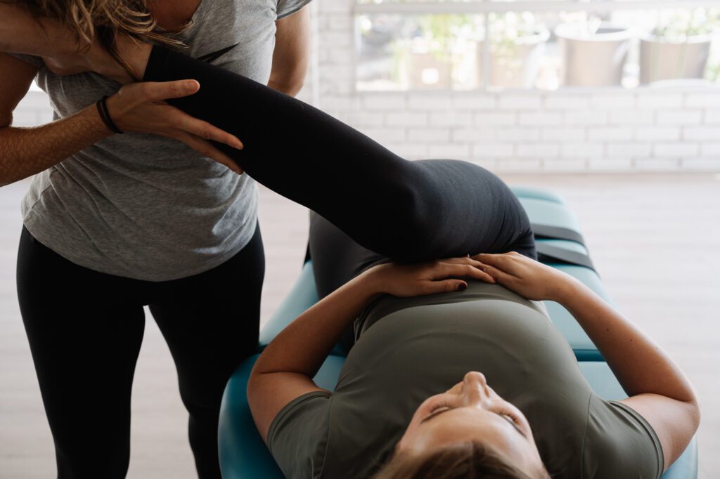 Stretch Therapist holding a clients leg