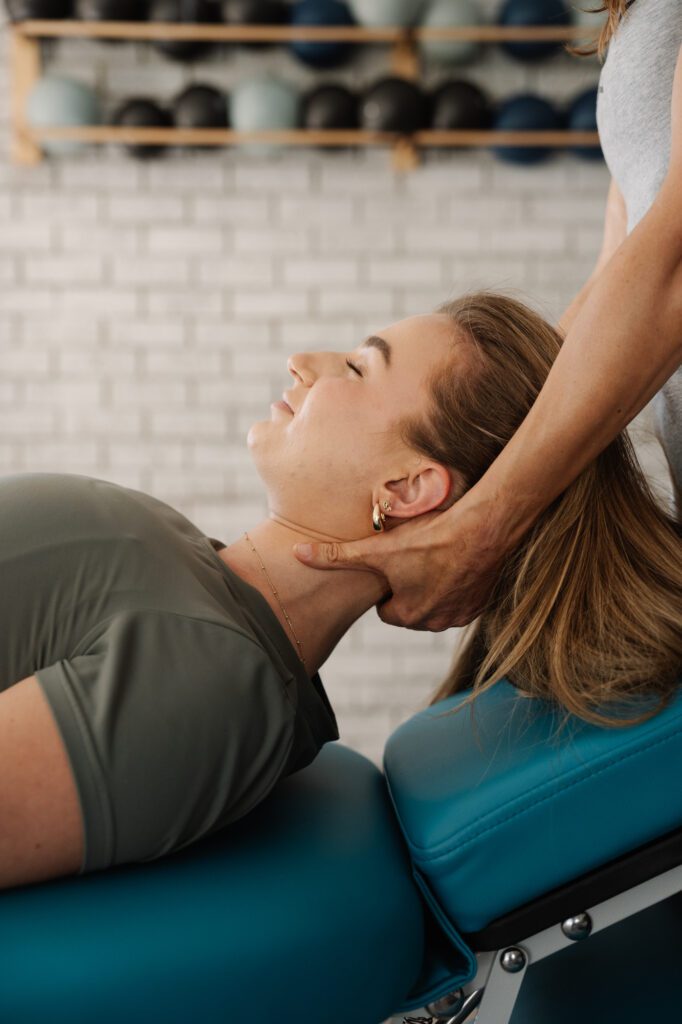 Stretch Therapist gently holding a clients neck